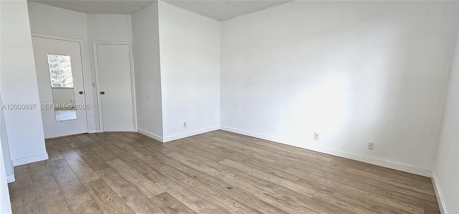 46 Simonton Circle Weston, FL 33326 - Photo 12 of 14 a view of a room with wooden floor