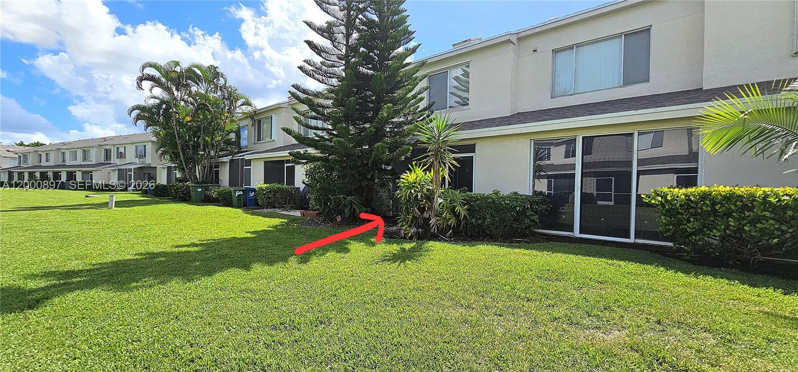 46 Simonton Circle Weston, FL 33326 - Photo 13 of 14 a view of a house with a yard patio and a yard