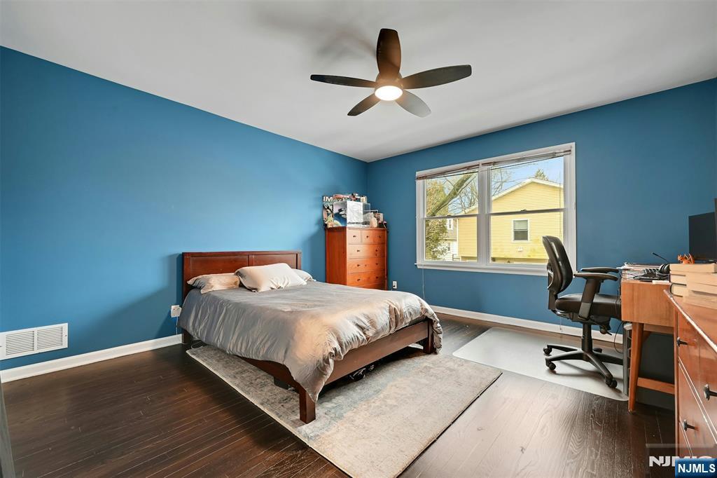 288 Schley Place Teaneck, NJ 07666 - Photo 12 of 29 a bedroom with a bed and a window