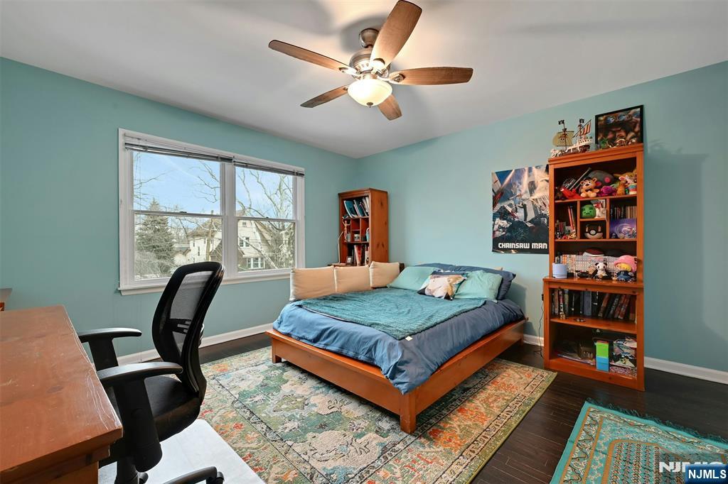 288 Schley Place Teaneck, NJ 07666 - Photo 14 of 29 a living room with furniture a rug and a window