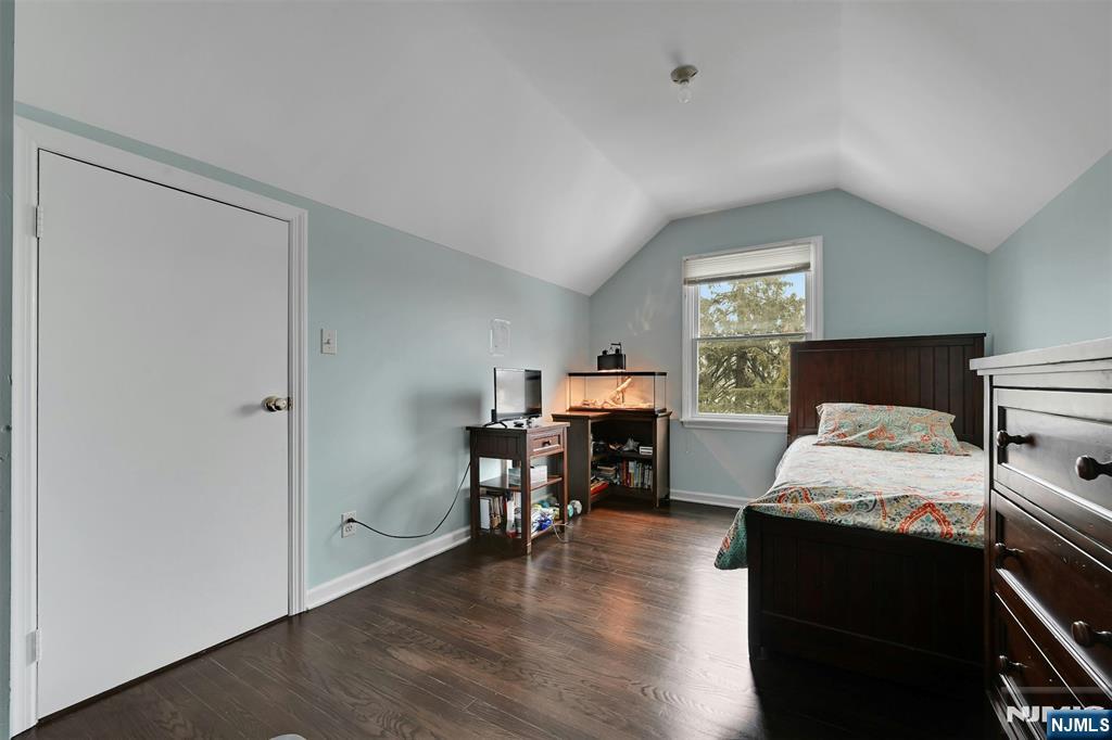 288 Schley Place Teaneck, NJ 07666 - Photo 15 of 29 a living room with furniture and a wooden floor