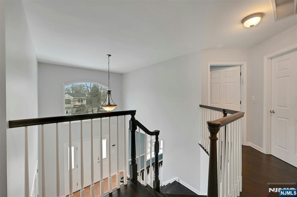 288 Schley Place Teaneck, NJ 07666 - Photo 17 of 29 a view of a hallway with windows