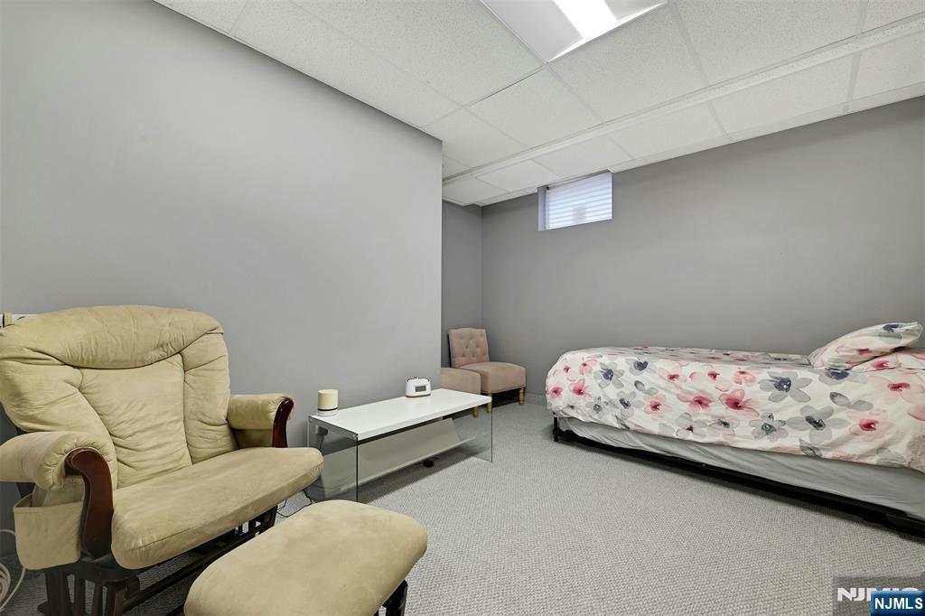 288 Schley Place Teaneck, NJ 07666 - Photo 20 of 29 a bedroom with bed and a couch