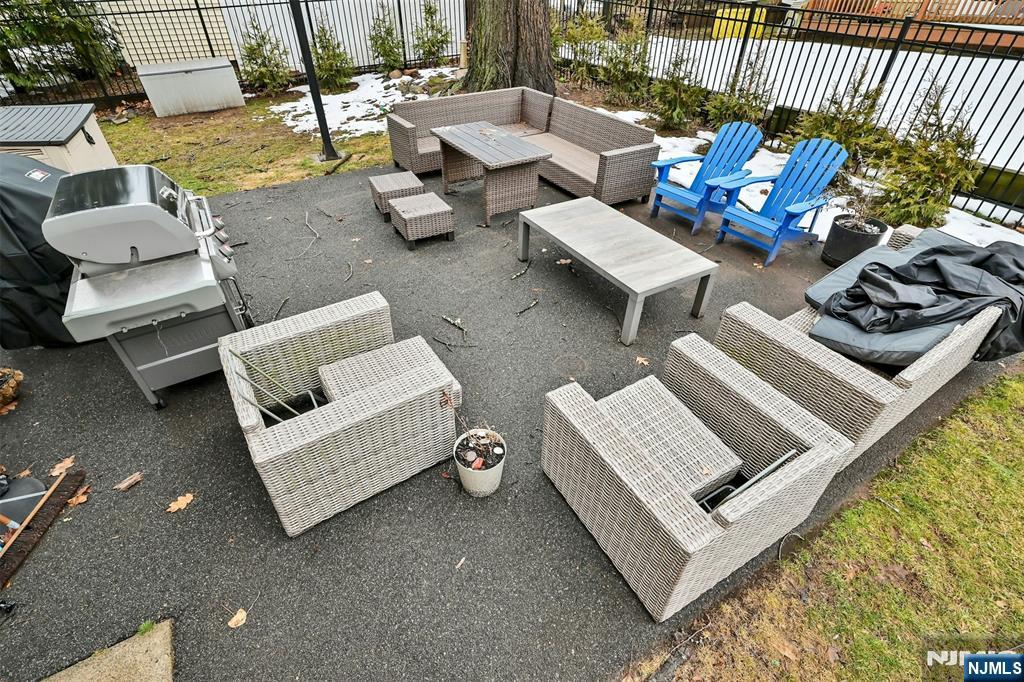 288 Schley Place Teaneck, NJ 07666 - Photo 24 of 29 a white couch sitting in the middle of a patio