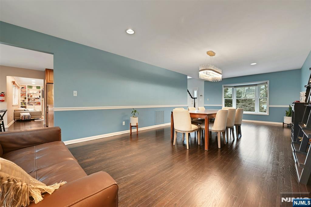 288 Schley Place Teaneck, NJ 07666 - Photo 3 of 29 a view of a dining room with furniture and wooden floor