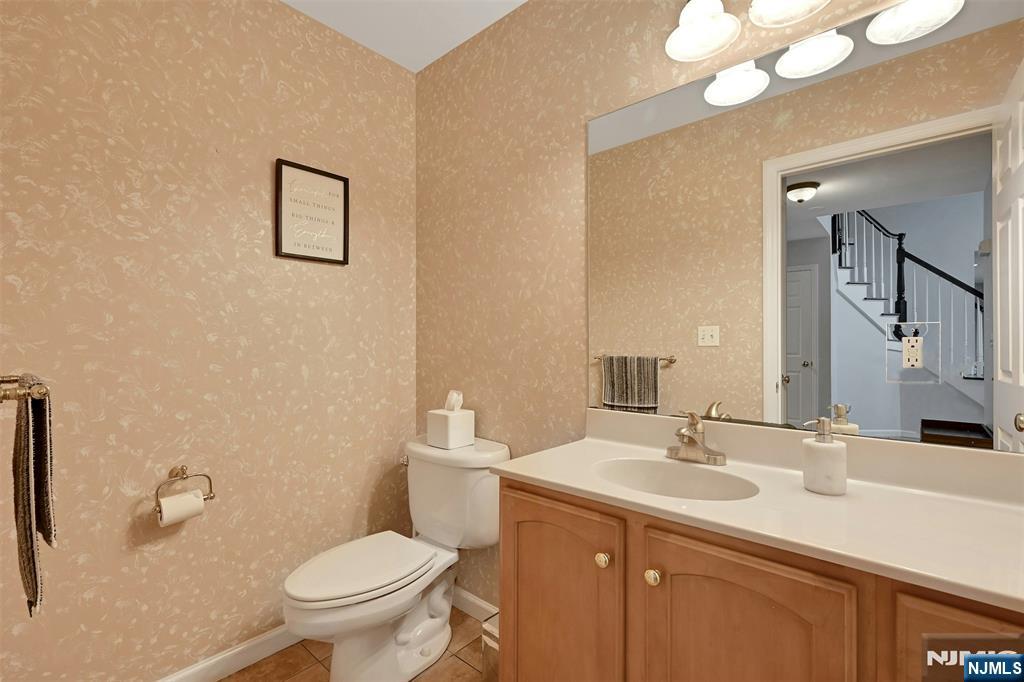 288 Schley Place Teaneck, NJ 07666 - Photo 8 of 29 a bathroom with a toilet sink and mirror