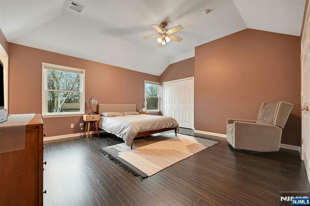 288 Schley Place Teaneck, NJ 07666 - Photo 10 of 29 a bedroom with a bed a couch and a window