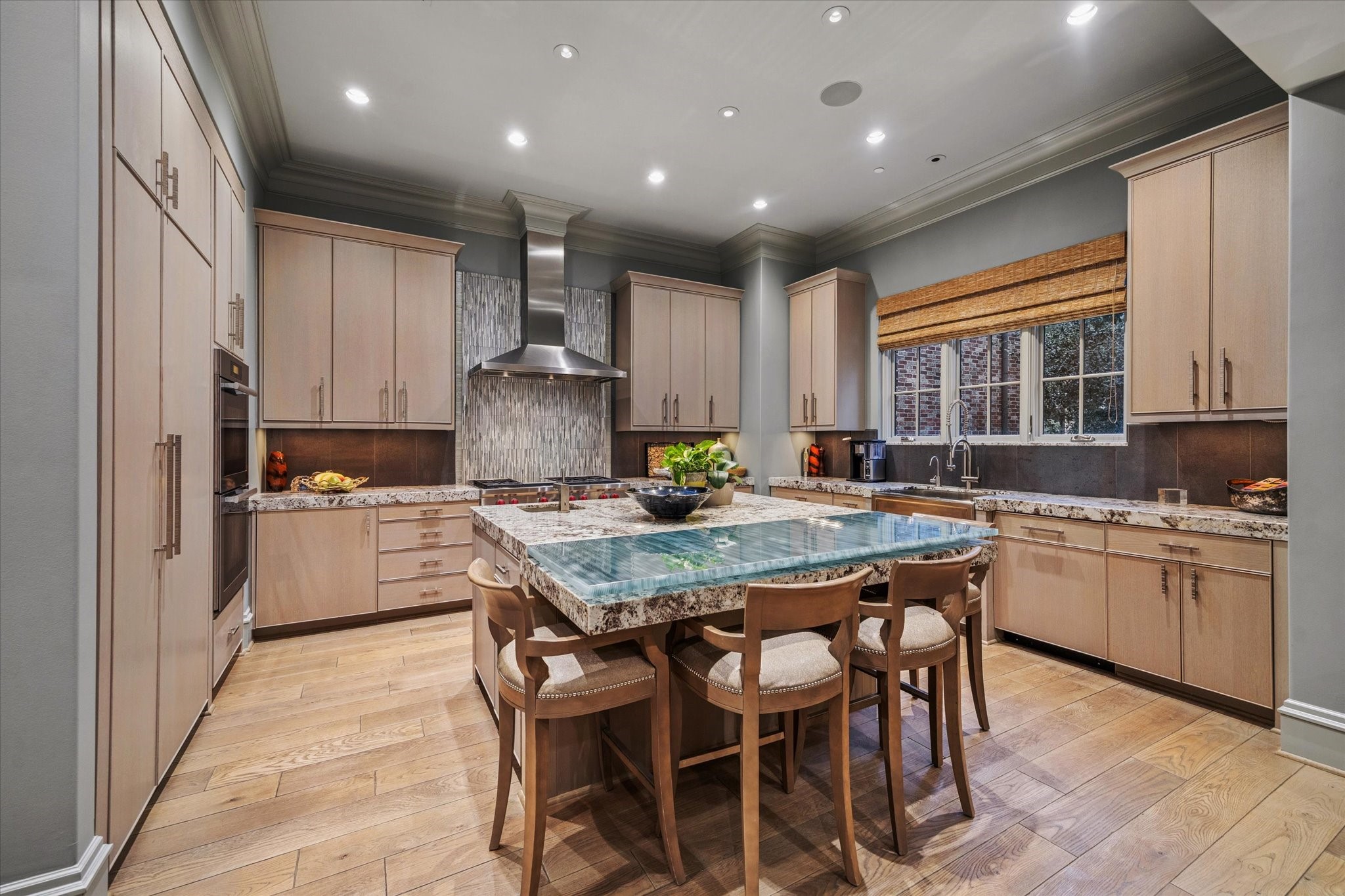 1225 Place Royale Way Houston, TX 77056 - Photo 18 of 45 a kitchen with granite countertop white cabinets and stainless steel appliances
