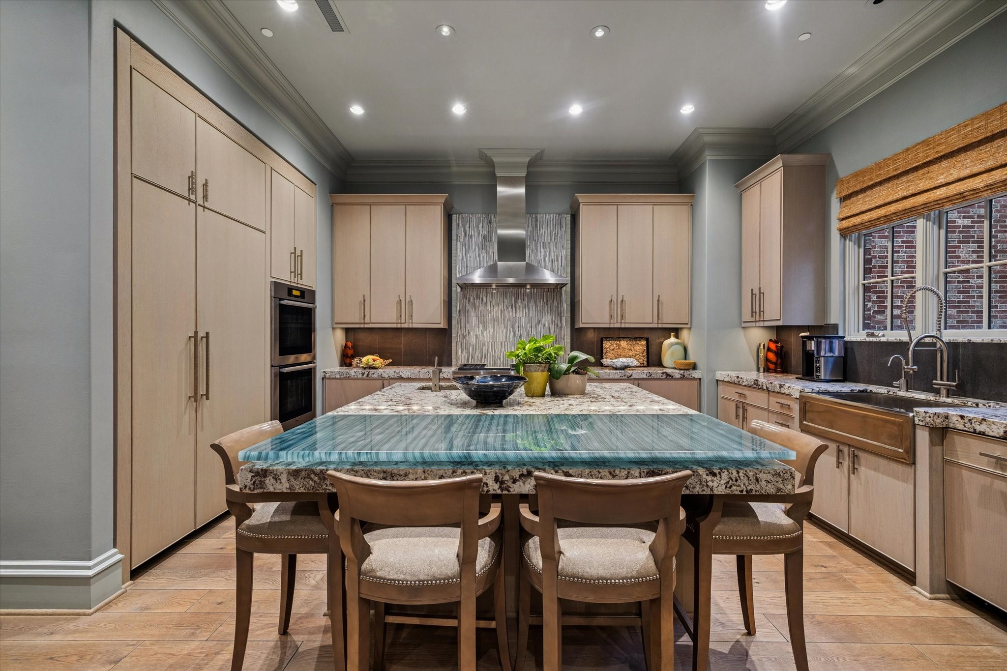 1225 Place Royale Way Houston, TX 77056 - Photo 19 of 45 a kitchen with kitchen island granite countertop wooden cabinets and refrigerator
