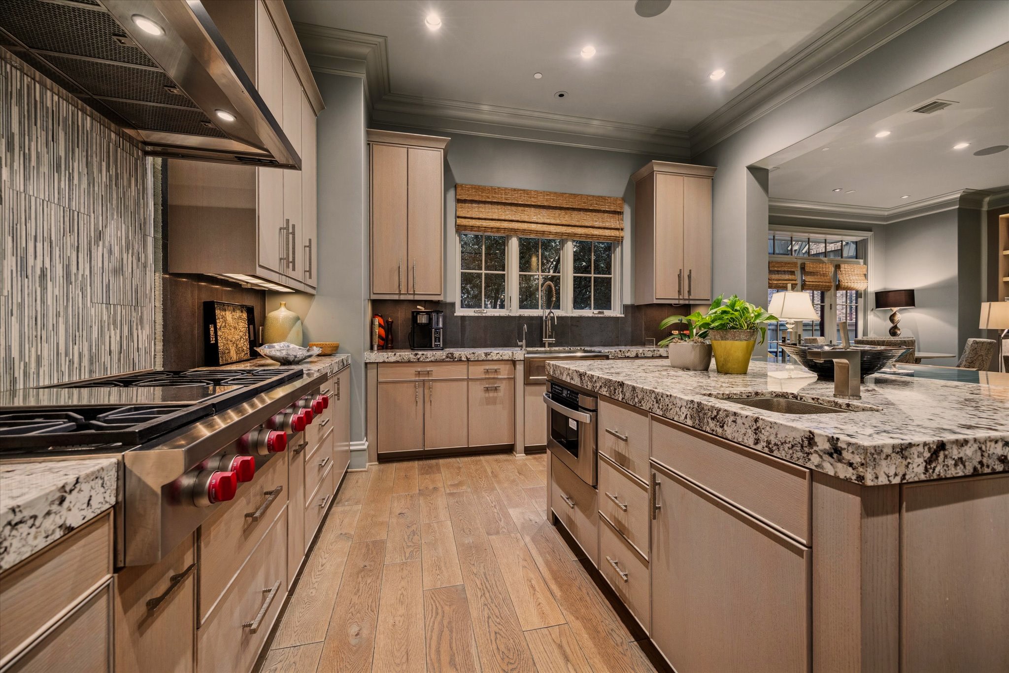 1225 Place Royale Way Houston, TX 77056 - Photo 20 of 45 a kitchen with a sink stove top oven and cabinets