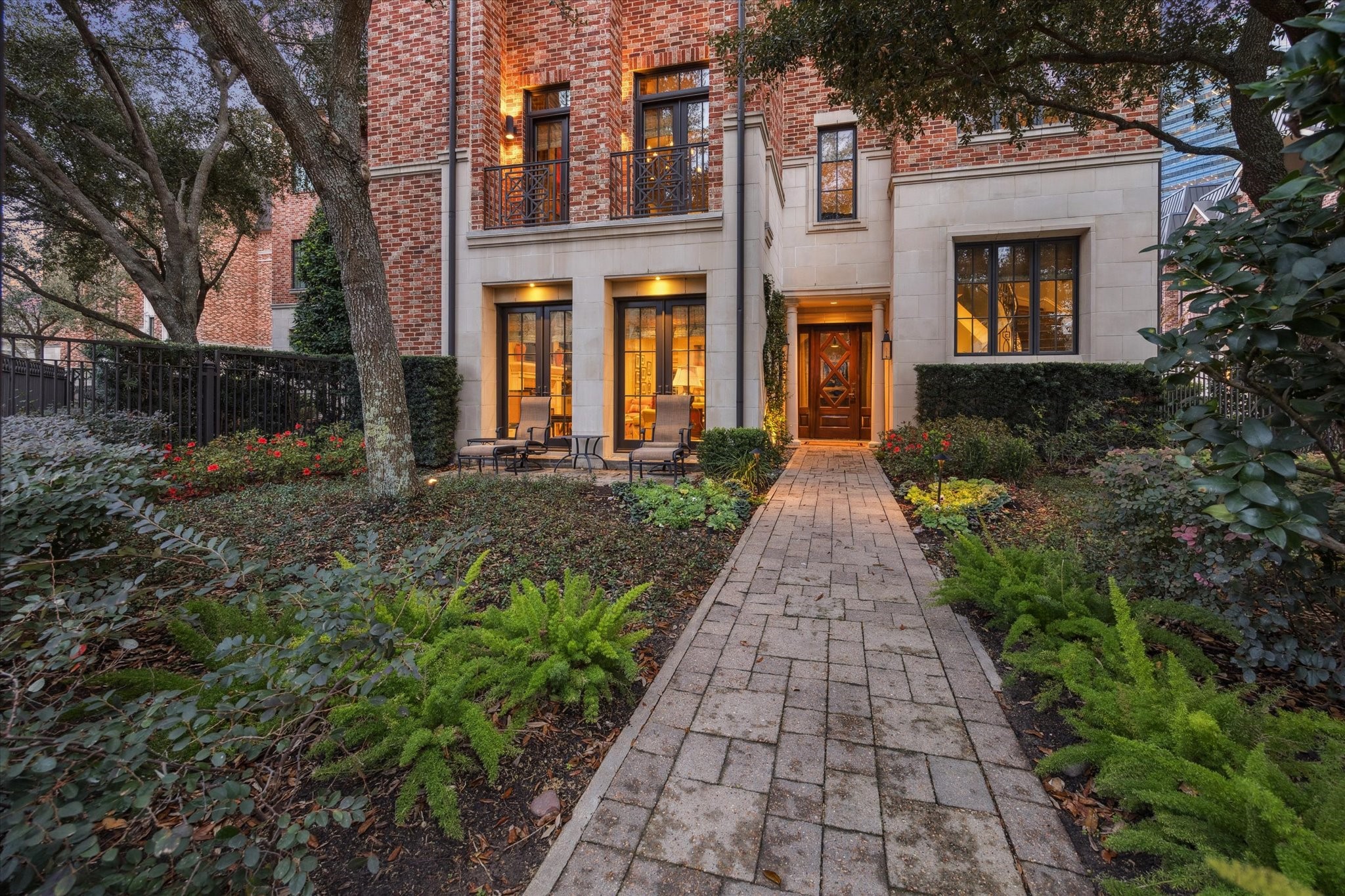 1225 Place Royale Way Houston, TX 77056 - Photo 2 of 45 front view of a brick house with a small yard