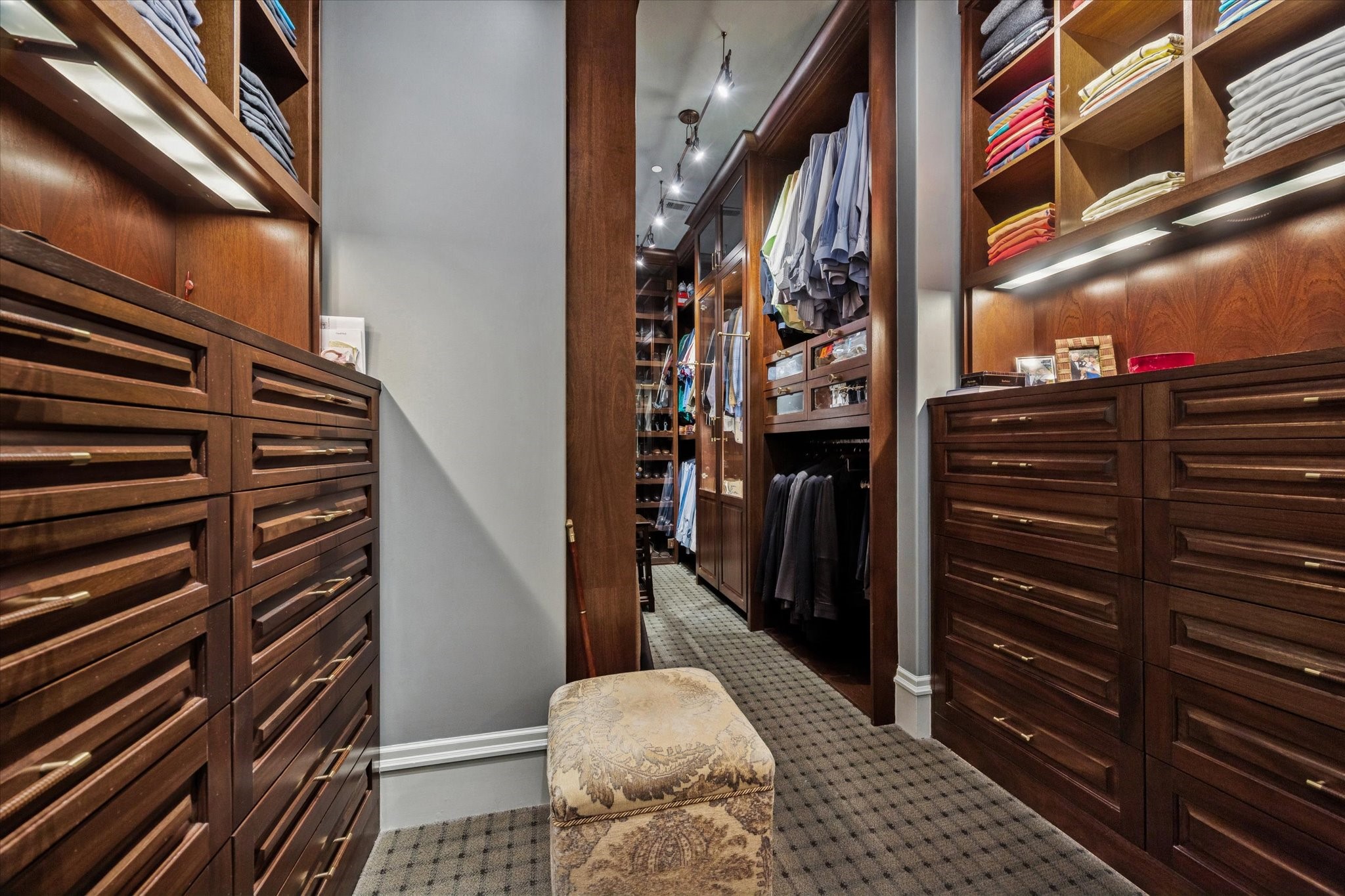 1225 Place Royale Way Houston, TX 77056 - Photo 30 of 45 a view of walk in closet and wooden floor