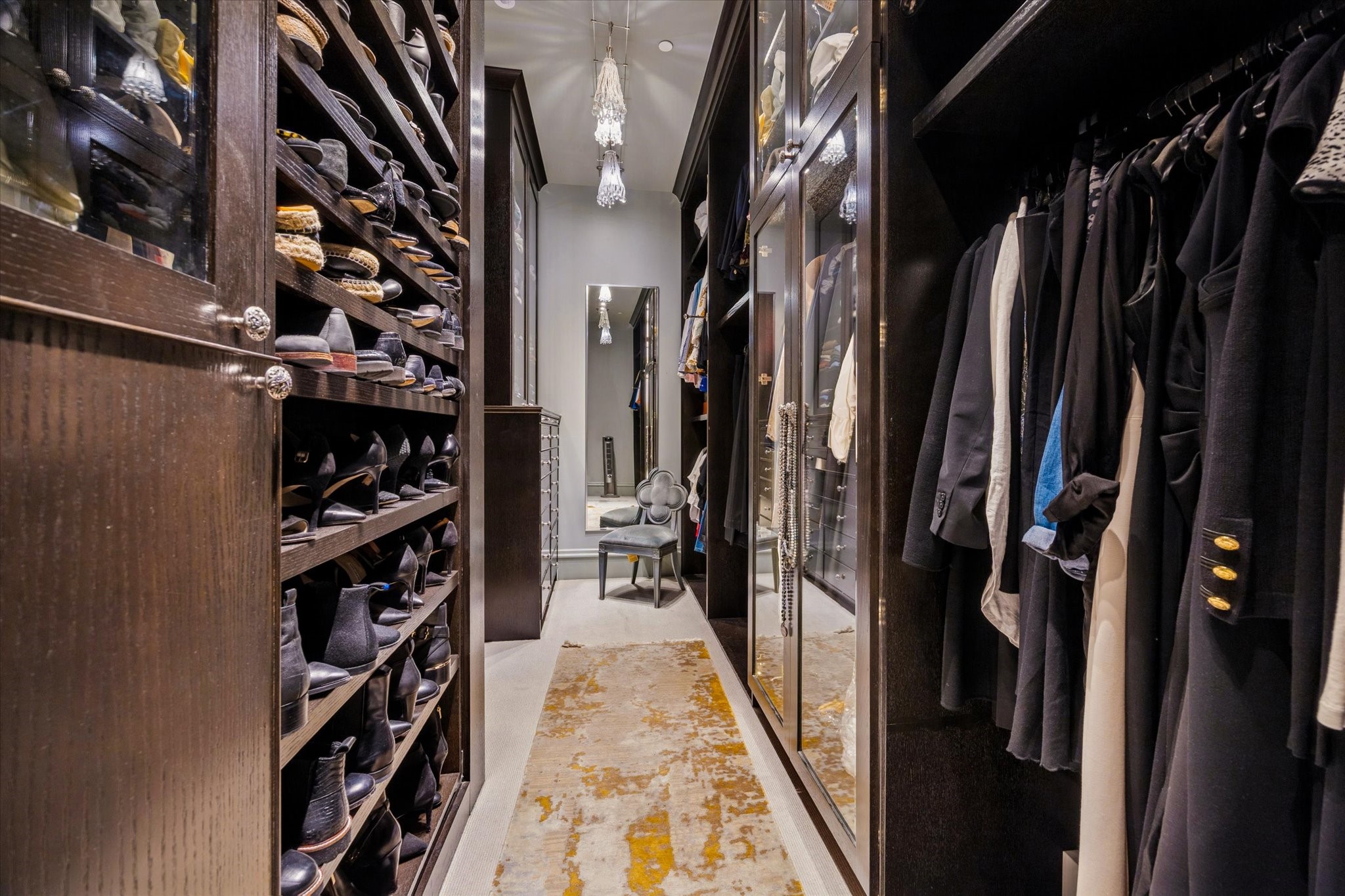 1225 Place Royale Way Houston, TX 77056 - Photo 31 of 45 a view of walk in closet with clothes and shoes