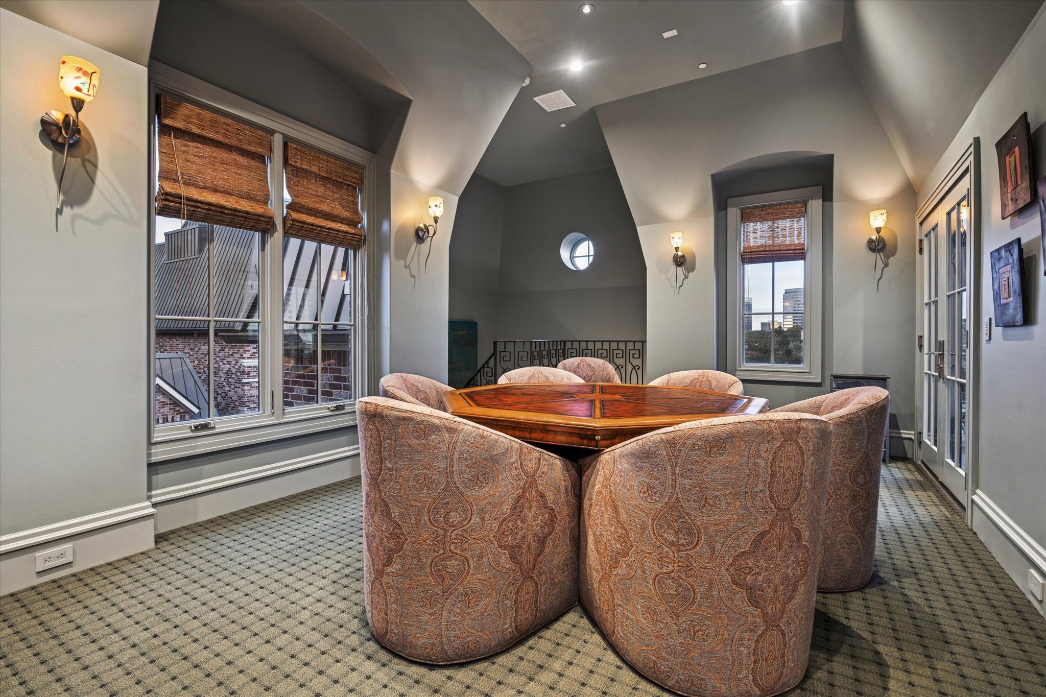 1225 Place Royale Way Houston, TX 77056 - Photo 35 of 45 a dining room with a large window and chandelier