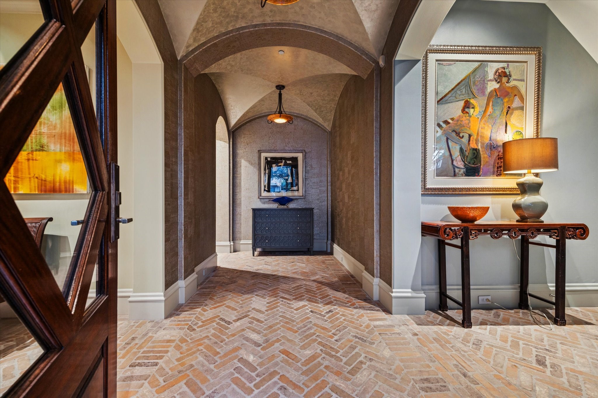 1225 Place Royale Way Houston, TX 77056 - Photo 4 of 45 a view of a hallway with paintings on the wall