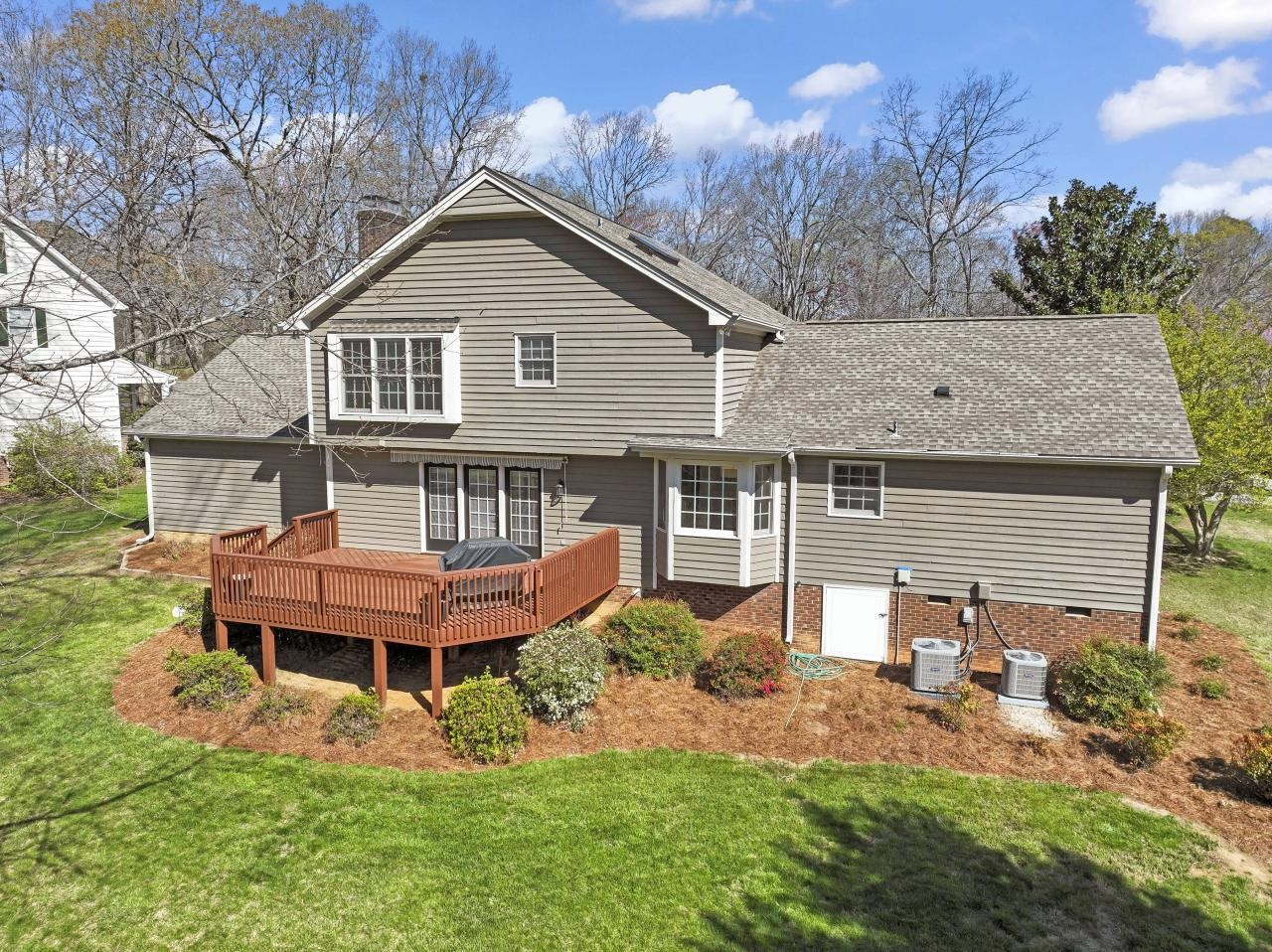 5013 Trail Ridge Drive Raleigh, NC 27613 - Photo 3 of 32 Large deck includes a roll out awning and dedicated gas line for the grill. Look over your gorgeous back yard with plenty of room for yard games. Exterior Back
