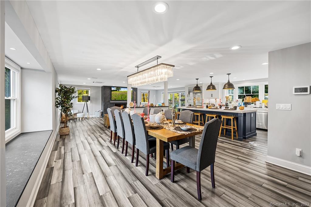 83 Gatehouse Road Trumbull, CT 06611 - Photo 1 of 1 a dining room with stainless steel appliances kitchen island granite countertop a table chairs and a rug