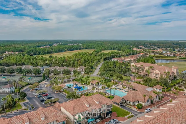 an aerial view of a house with outdoor space