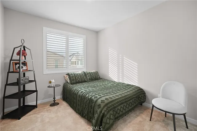 a bedroom with a bed and a chair