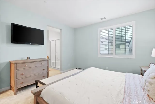a bathroom with a shower sink and mirror