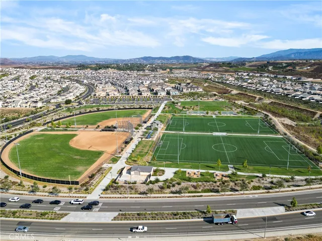a view of a swimming pool with a lawn chairs
