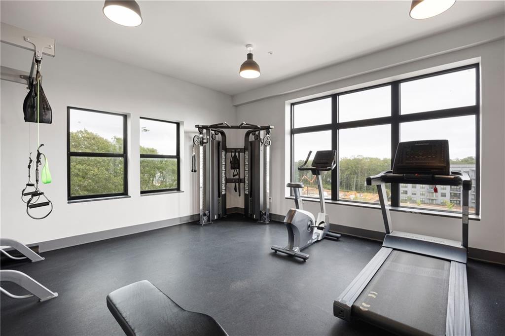 112 Rogers Street Northeast, Unit 202 Atlanta, GA 30317 - Photo 17 of 36 a view of a livingroom with lounge chair and a large window