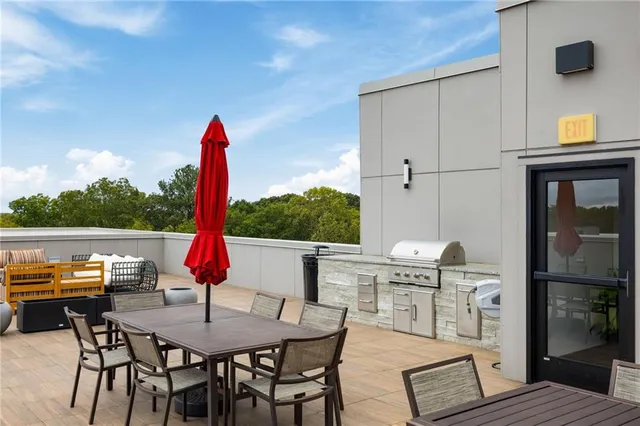 a view of deck with table and chairs and wooden floor