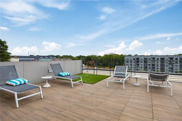 a view of a terrace with furniture and stove