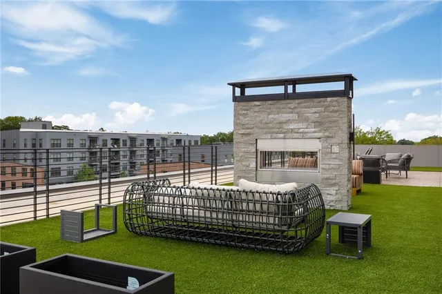 a view of a chairs and table in the patio
