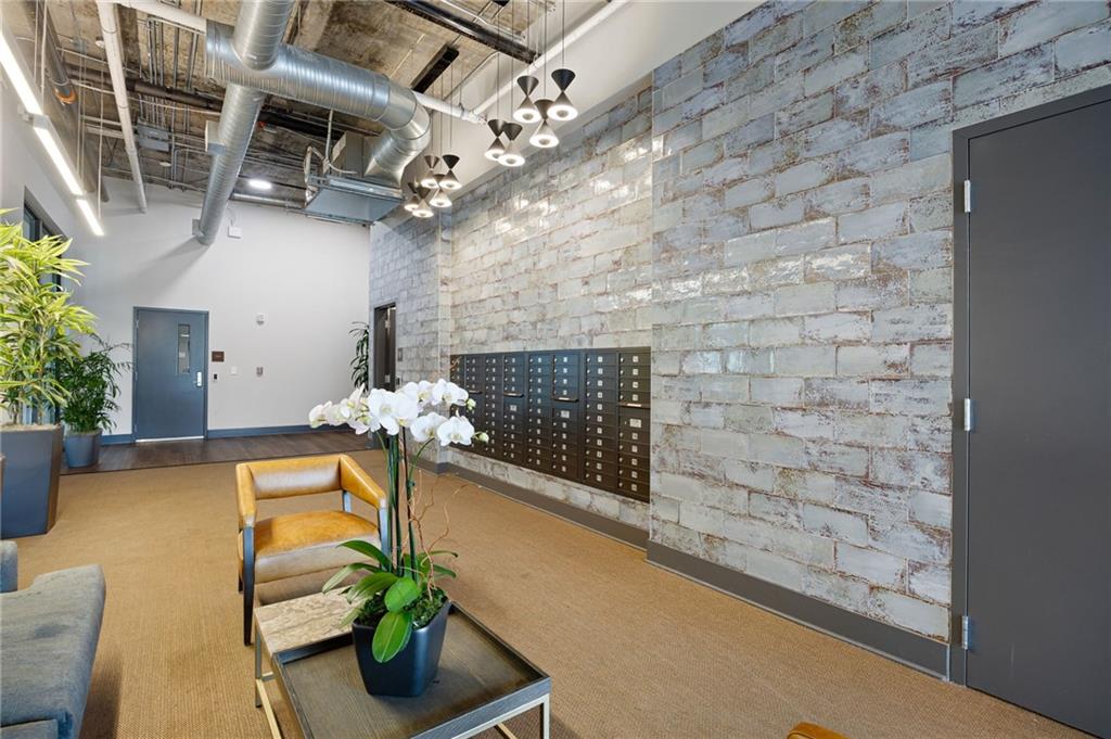 112 Rogers Street Northeast, Unit 202 Atlanta, GA 30317 - Photo 27 of 36 a vase of flowers sitting on a table