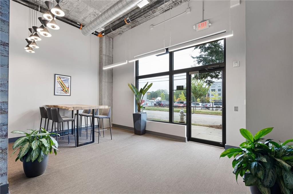 112 Rogers Street Northeast, Unit 202 Atlanta, GA 30317 - Photo 28 of 36 a livingroom with furniture and a potted plant