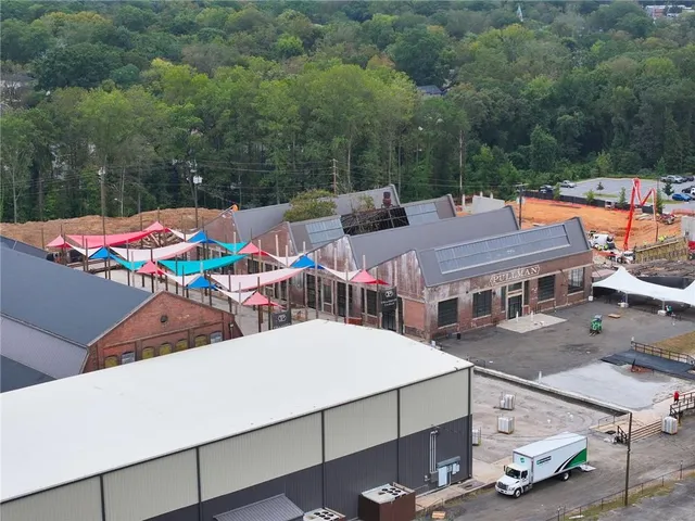 an outdoor space with furniture and city view