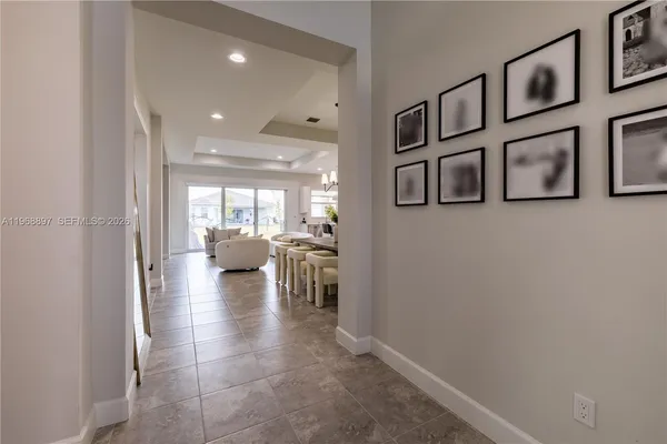 a view of a hallway with seating area