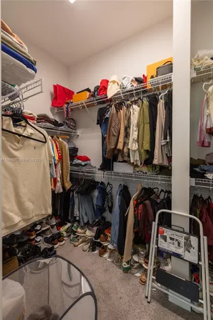 a utility room with cabinets washer and dryer