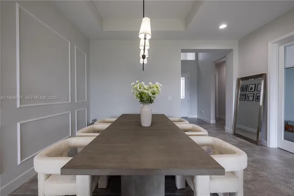 a view of kitchen with granite countertop living room