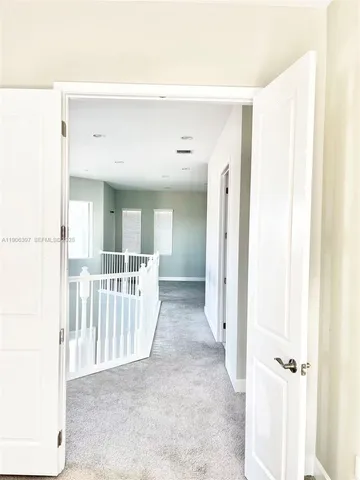 a spacious bathroom with a granite countertop sink and a mirror