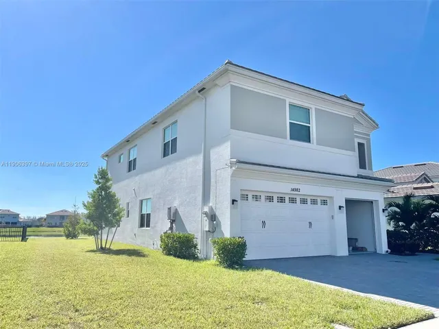a view of a house with pool and a view of a house