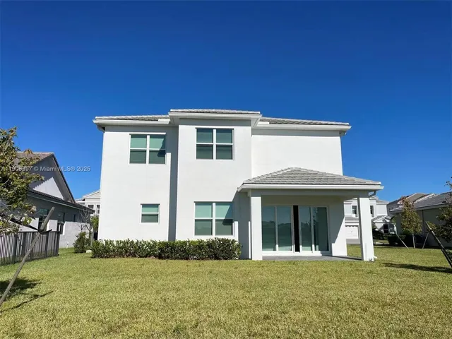 a view of a lake with houses in the back