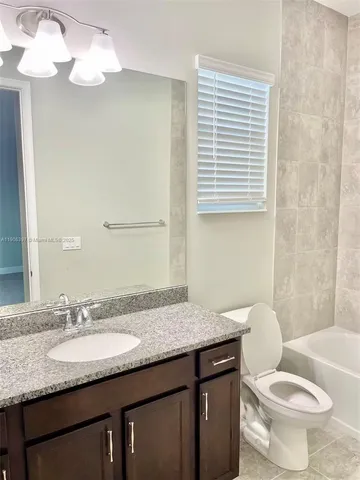 a view of a hallway with windows