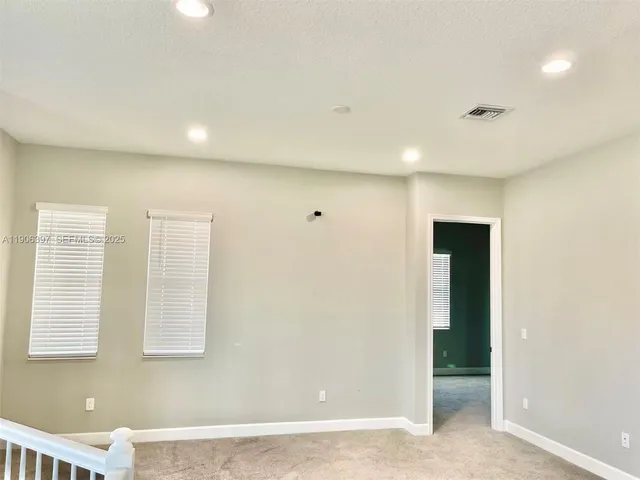 a bathroom with a toilet and a bathtub