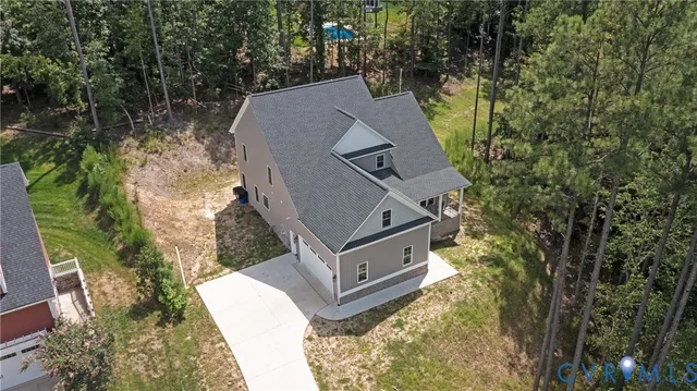 a aerial view of a house with a yard