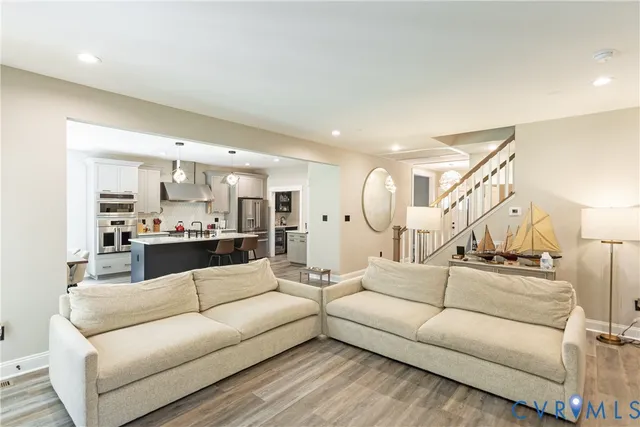 a living room with furniture fireplace and window