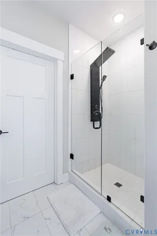 a spacious bathroom with a tub sink and mirror