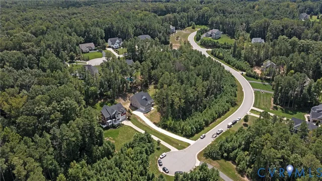 an aerial view of house with outdoor space and street view