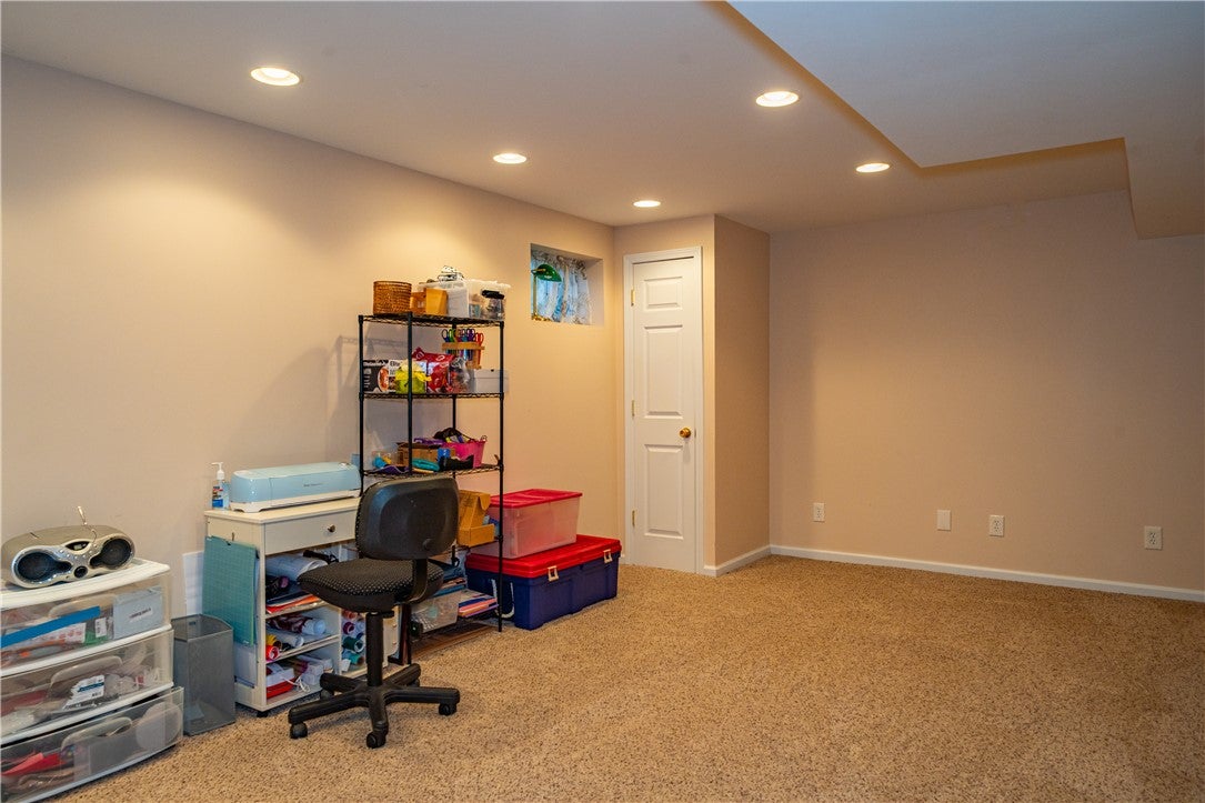 10765 Stone Ridge Way Harrison, OH 45030 - Photo 42 of 68 A well-lit, finished basement space offers versatile use with carpeted floors and recessed lighting.