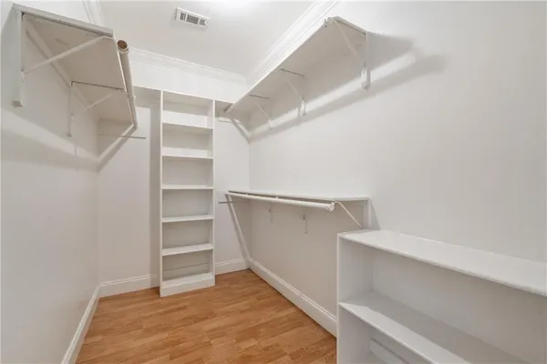 a view of an empty walk in closet