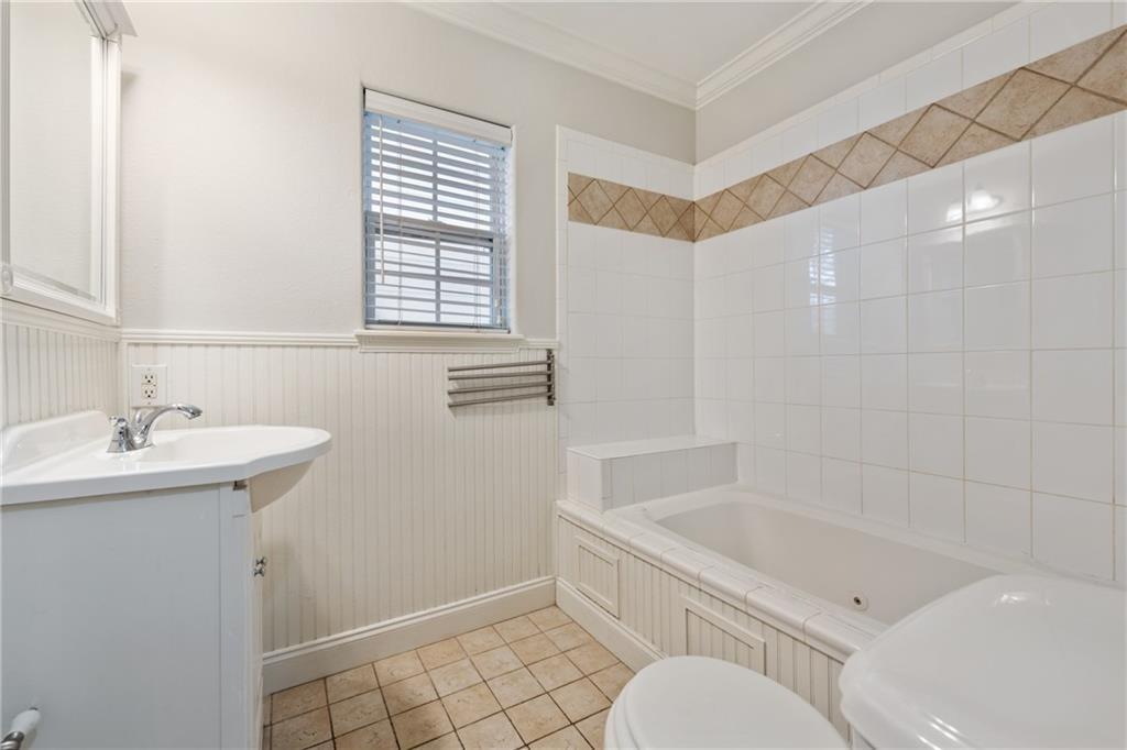 714 East 45th Street Austin, TX 78751 - Photo 15 of 26 a bathroom with a sink toilet and shower
