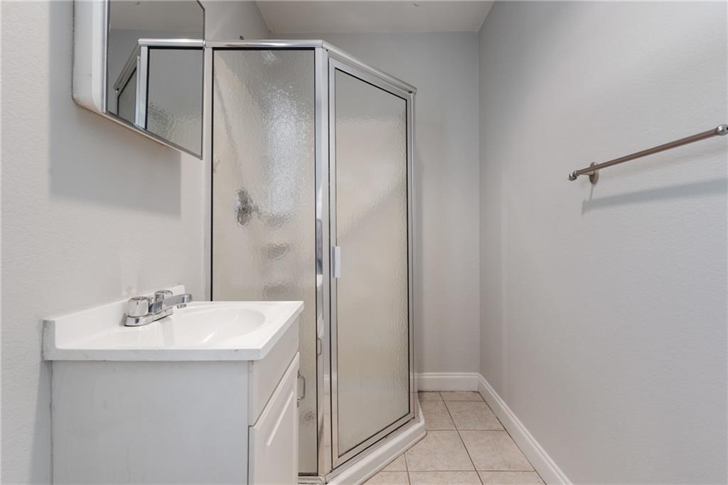 714 East 45th Street Austin, TX 78751 - Photo 25 of 26 a bathroom with a sink and mirror