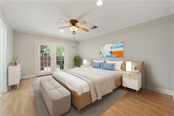 a bedroom with a large bed and a window