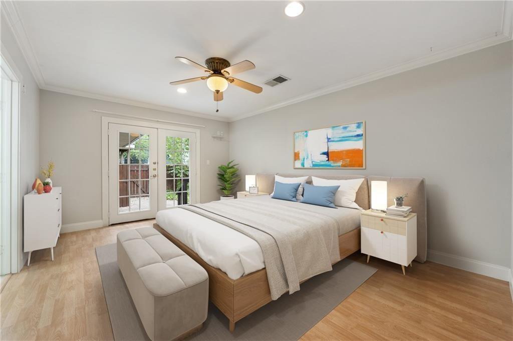 714 East 45th Street Austin, TX 78751 - Photo 7 of 26 a bedroom with a large bed and a window